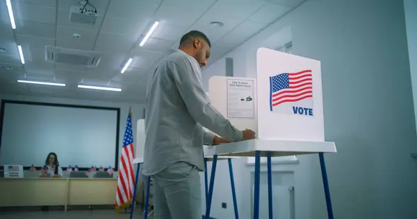 African American Male Voter Walks Registration Table Polling Station Takes — Stock Photo, Image