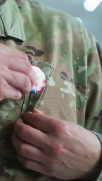 Vertical Shot Military Man Putting Badge American Flag Logo Inscription — Stock Video