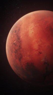 Mars 'ın karanlık uzayda dönüşünün gerçekçi üç boyutlu animasyonu. Arka planda yıldızlar ve galaksiler. Güneş sistemi kırmızı gezegen. Geleceğin insan kolonizasyonu ve evren keşfi kavramı. Dikey çekim