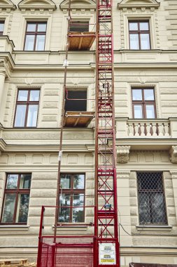 Facade of the historic building under reconstruction in Prague.