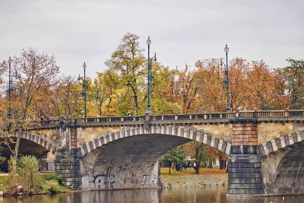 Stone old bridge above the Vltava river in Prague.