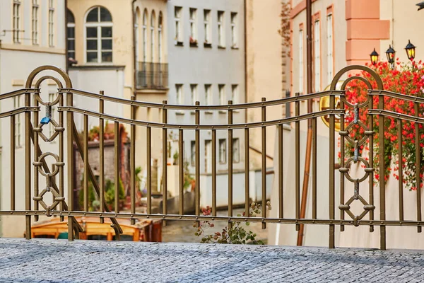 Beautiful bridge and its fence over the canal Certovka in Prague, with padlock.