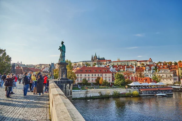 People tourists on the iconic Charles Bridge in Prague.