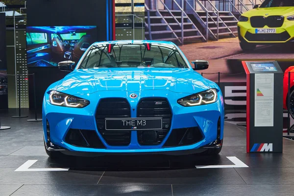 Munich, Germany - October 12th 2022 - The BMW Welt, blue BMW M3 front, headlights, hood and grill.