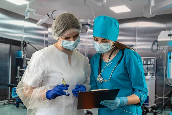 two doctors or nurses are considered heroes of the work performed during pandemics or crises caused by the coronavirus. medicine. nurses operating room