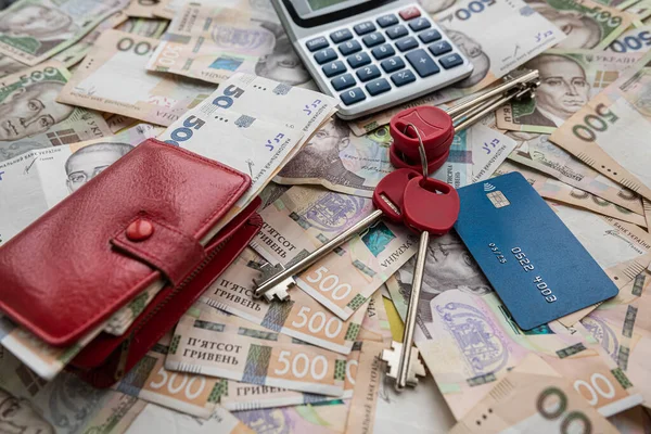 business concept sale or rent home ukraine money uah gryvnia calculator credit card and purse, saving concept