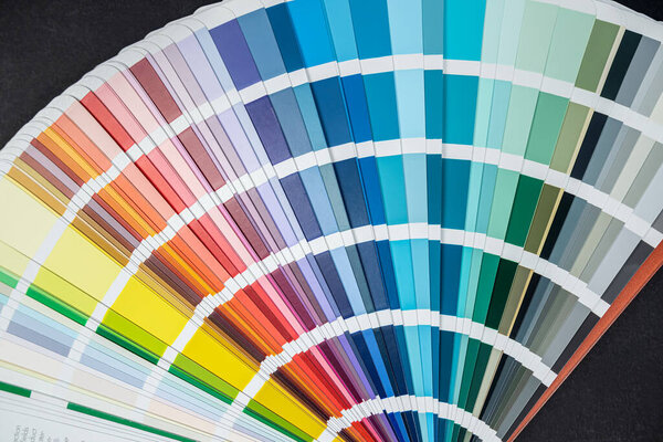 many different color palettes sepmler rainbow fan spread out on the table. isolated all for design. repair and design.