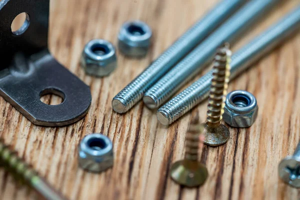 stock image Lots of self-tapping screws and nails and construction screws and metal and plastic drywall anchors. Repair and tools for it