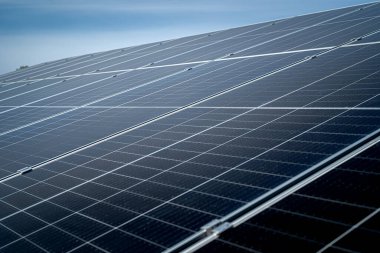 Sun energy with solar panels close up. View on the blue sky