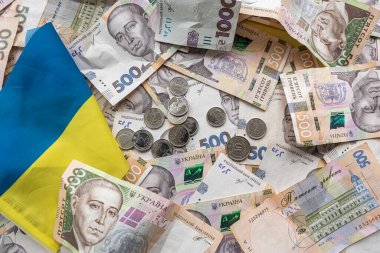 new 500 1000 Ukrainian hryvnia banknotes and coins as background. Ukrainian national currency bills. Wealthy