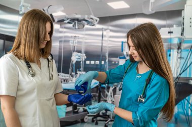 two young nurses in special clothes work in a hospital. medicine. concept of medicine. medical personnel