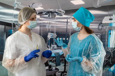 two young nurses in special clothes work in a hospital. medicine. concept of medicine. medical personnel