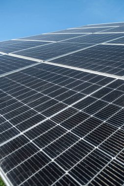 Panels of solar renewed economical batteries on the background of the blue sky. Against a deep blue sky in sunny weather. economic panels