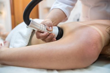 professional massage therapist woman makes a relaxing massage for a good client. spa treatments. the best salon