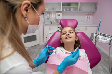 small beautiful patient came to the children's state-of-the-art dentistry for an oral examination. the concept of a healthy oral cavity