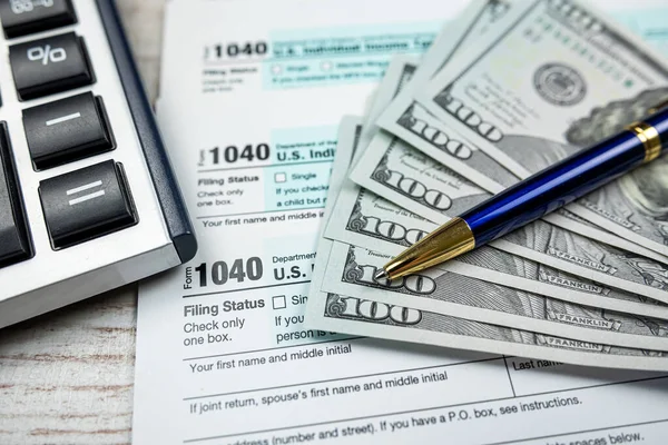 Business Accounting Concept 1040 Tax Form Pen Calculator Dollar Bills — Fotografia de Stock