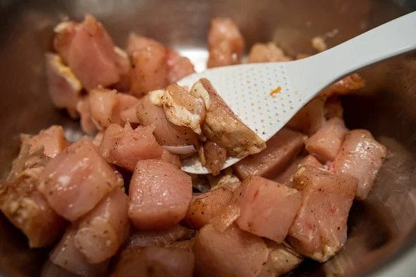 stock image marinated sliced pork pieces cooked and sliced in a barbecue bowl waiting to be cooked