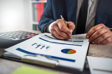 Business man work with charts and graphs showing the results. Accounting concept