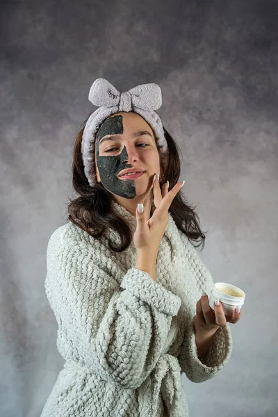 Beautiful Young Woman Black Face Mask Holding Bottle Cream Plastic — Stock Photo, Image