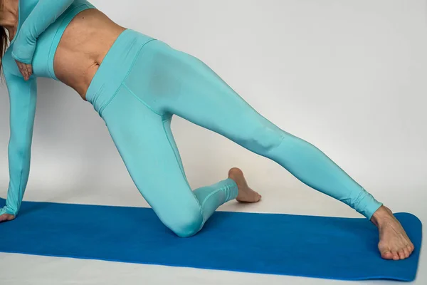 Sporty Woman Sportswear Practices Yoga Performing Pose Trains Muscle Flexibility — Fotografia de Stock