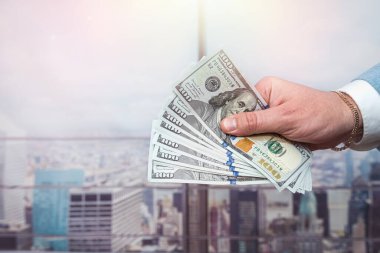 Hands of businessman holding us dollar bills close up, investment. finance concept