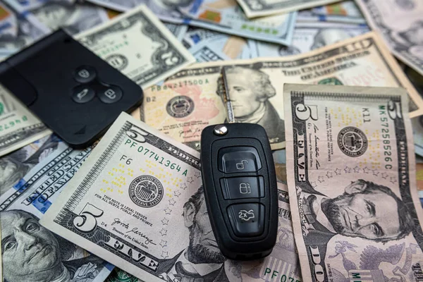 Buy or sell or insyrance auto car - US dollar with keys on desk. Investment