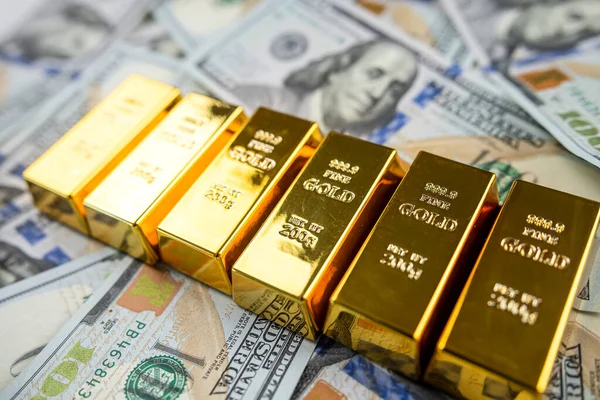 stock image Gold bars in 100 dollar bills financial asset. Saving investment and wealth concept.