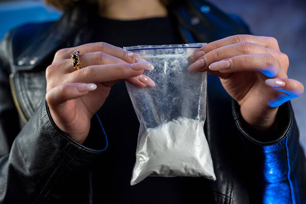 Drug dealer wear dark black cloth selling drugs heroine junkie, illegal concept