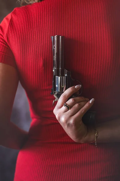 Young Woman Red Dress Holding Gun Pistol Crime Concept Back — Stockfoto