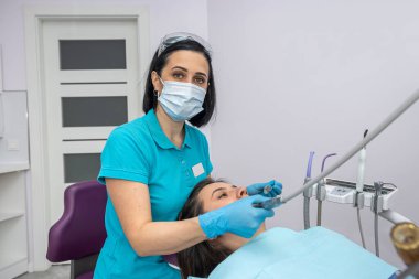 top view of a girl patient who came to check her teeth at the dentist. The concept of healthy teeth