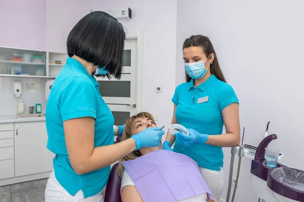 Two Dentists Women Special Clothes Look Teeth Patient Caries Concept — 스톡 사진