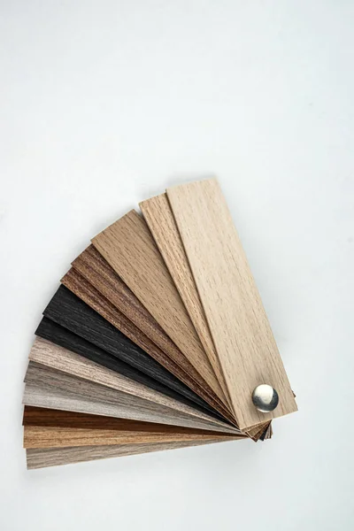 different wooden color swatch laminate samples for for housing renovation project. Architecture and construction