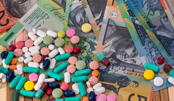 stock image Australian dollars money AUD with different pills, medicine concept, pharmacy
