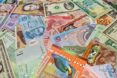 different American world paper money as background. top view