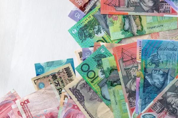 finance background with yaun chinese, japanese yen and aud australian dollar. Investment