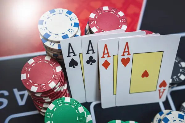 The winning combination is four aces cards and chips on casino table. Poker game