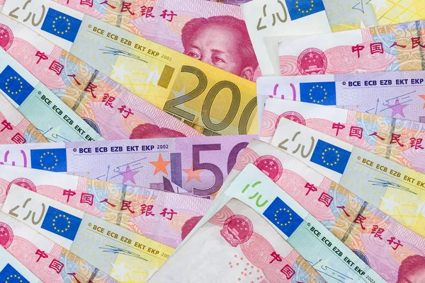 World money - China yuan and Euro paper banknotes. Investment