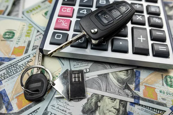 keys of house and car with calculator on us dollar money, Investment in future, purchase or rent concept