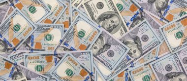 Finans sektörü geçmişi olarak 100 dolarlık Amerikan banknotları. Dolar enflasyonu USD