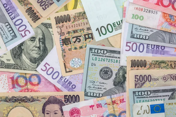 World money - America Europe Japan and China paper banknotes. Investment concept