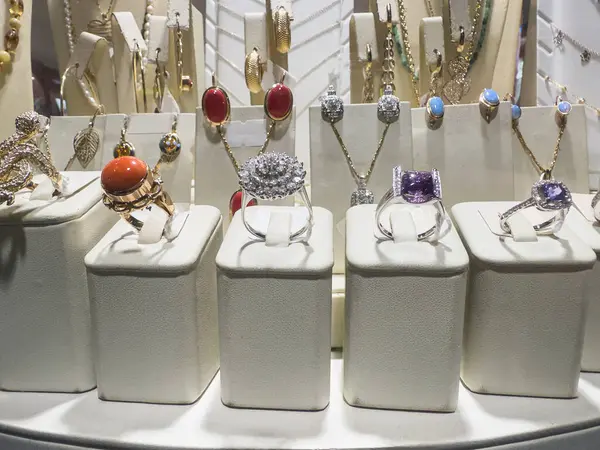 Jewelry diamond female luxury gold bracelets ring and earring in a jewellery store.