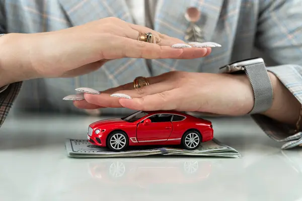 Insurance or protect car with dollar money and hand of vechicle. Sale or rent automobile