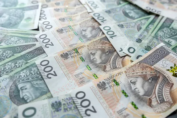stock image Many polish banknotes 100, 200 as financial background. Deepening inflation in Poland