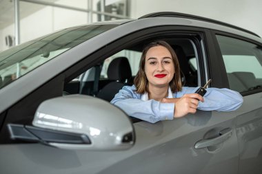 buyer client inside modern car at showroom, concept of sale or rent vechile. transportation