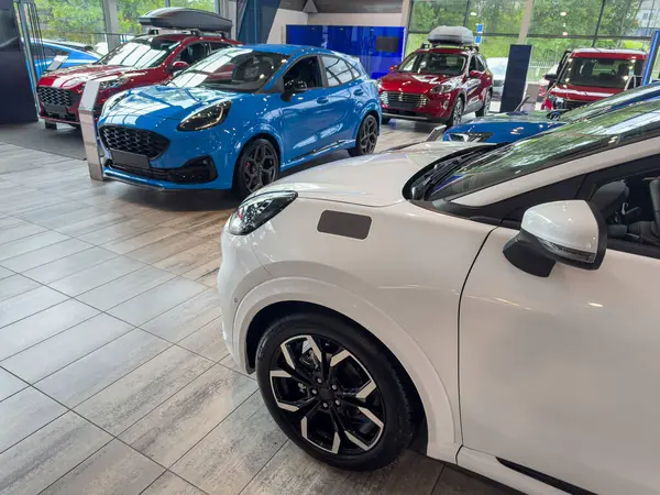 stock image close up of new luxury cars parked in the auto salon. On the expo floor in new car service