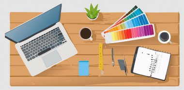 Bir dizüstü bilgisayar, birkaç kitap, boya fırçaları ve konfor için küçük bir yelpaze içeren çalışma masası sergilenen piksel sanat tarzında sanatsal bir tasvir.