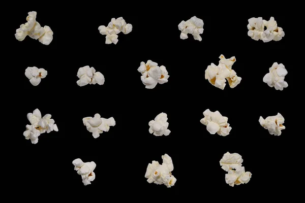 Popcorn set isolated on black background. Popcorn is suitable for creating levitation effect and design.