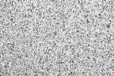 Light gray granite texture with small inclusions. Minimalistic background for various projects.