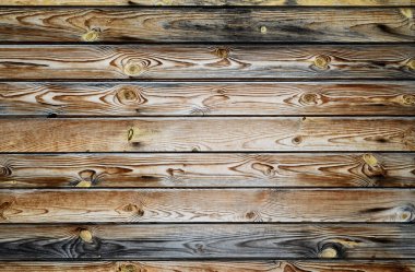 Ahşap arka plan. Yıpranmış eski tahtaların lifli ve düğümlü dokusu.