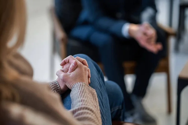 stock image Conversation. Man and woman sitting opposite each other and talking